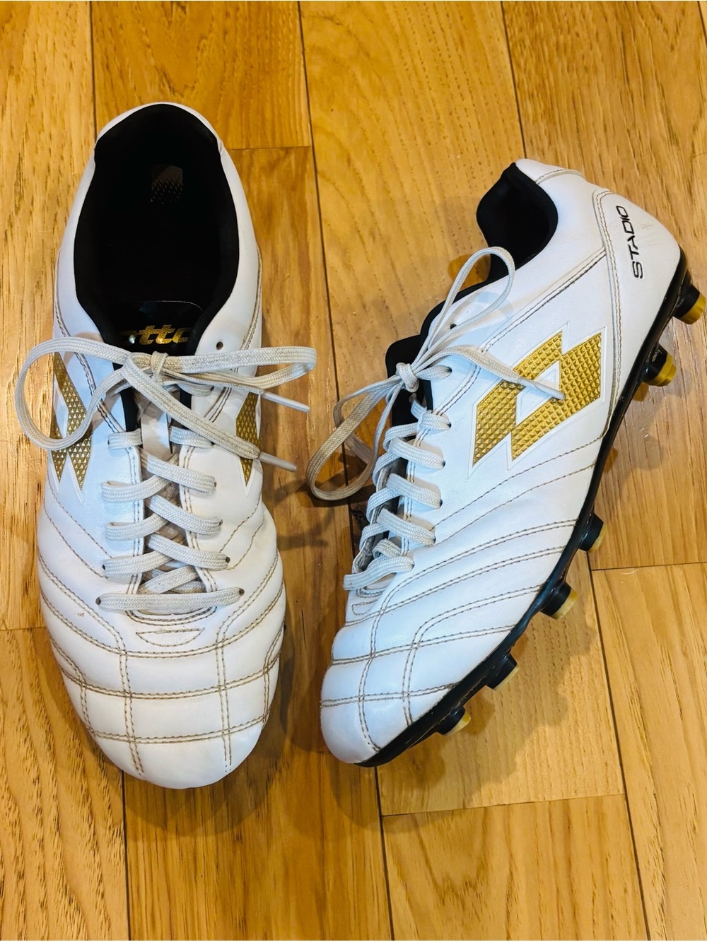 Lotto Stadio White Soccer Cleats With Black & Gold Accents